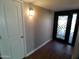 Welcoming entryway features a modern door with decorative glass and a wood-look flooring at 10116 W Bolivar Dr, Sun City, AZ 85351