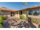 Home with a beautiful brick entryway and lush, green landscaping at 10116 W Bolivar Dr, Sun City, AZ 85351