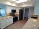 Bright kitchen features white cabinets, stainless steel appliances and granite countertops at 10116 W Bolivar Dr, Sun City, AZ 85351