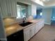 Kitchen with granite countertops, stainless steel sink and views of other living spaces at 10116 W Bolivar Dr, Sun City, AZ 85351