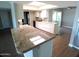 This kitchen features a skylight, sleek appliances, and granite countertops that offer plenty of space at 10116 W Bolivar Dr, Sun City, AZ 85351