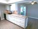 White kitchen featuring granite countertops and stainless steel appliances at 10116 W Bolivar Dr, Sun City, AZ 85351