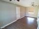 This room features wood look floors, a ceiling fan, and a door to the exterior at 10116 W Bolivar Dr, Sun City, AZ 85351