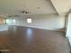 Open-concept living room featuring modern ceiling fan, sliding doors, and contemporary lighting at 10116 W Bolivar Dr, Sun City, AZ 85351