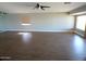 Spacious living room features wood flooring and ample natural light at 10116 W Bolivar Dr, Sun City, AZ 85351