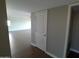 Spacious living room with neutral paint, baseboards, and wood-look flooring at 10116 W Bolivar Dr, Sun City, AZ 85351