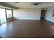 Large living room featuring wood look floors, ceiling fan, and lots of space at 10116 W Bolivar Dr, Sun City, AZ 85351