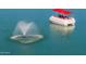 Leisure pontoon boat with fountain feature in the water at 10116 W Bolivar Dr, Sun City, AZ 85351