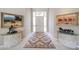 Inviting foyer with tile floors, decorative rug, art and furniture creating an elegant first impression of the home at 10125 N 78Th Pl, Scottsdale, AZ 85258