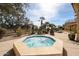 Relaxing hot tub surrounded by desert landscaping, providing a private and tranquil outdoor spa experience at 10125 N 78Th Pl, Scottsdale, AZ 85258