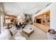 Spacious living room featuring a vaulted ceiling, custom built-ins, and an open floor plan at 10125 N 78Th Pl, Scottsdale, AZ 85258