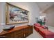 Comfortable living room with a decorative cabinet and beautiful painting at 10125 N 78Th Pl, Scottsdale, AZ 85258