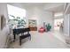 Bright living area showcasing a grand piano and a large picturesque painting at 10125 N 78Th Pl, Scottsdale, AZ 85258