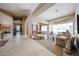Bright, open living room with travertine floors and neutral decor at 10125 N 78Th Pl, Scottsdale, AZ 85258