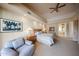 Relaxing main bedroom with a sitting area and ensuite bathroom access at 10125 N 78Th Pl, Scottsdale, AZ 85258
