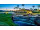 Beautiful water feature at sunset near the golf course at 10125 N 78Th Pl, Scottsdale, AZ 85258