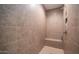 Close-up of a tiled walk-in shower featuring a built-in bench seat and modern fixtures at 11673 N 136Th St # 1005, Scottsdale, AZ 85259