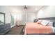 Bright bedroom with a queen-sized bed, ceiling fan, ample natural light, and neutral decor at 11673 N 136Th St # 1005, Scottsdale, AZ 85259
