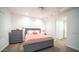 Bright bedroom featuring stylish gray furniture, neutral walls, and a cozy ceiling fan at 11673 N 136Th St # 1005, Scottsdale, AZ 85259