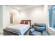 Bedroom featuring a leather armchair, large window, and ensuite bathroom at 11673 N 136Th St # 1005, Scottsdale, AZ 85259