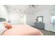 Bright bedroom features a gray dresser, soft carpet, neutral walls, and access to an outdoor patio at 11673 N 136Th St # 1005, Scottsdale, AZ 85259
