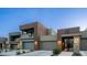 Modern townhome exteriors featuring neutral earth tones, private garages, and desert landscaping at 11673 N 136Th St # 1005, Scottsdale, AZ 85259