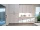 Bright kitchen features white cabinets, quartz countertops, and modern stainless steel appliances at 11673 N 136Th St # 1005, Scottsdale, AZ 85259