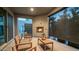 Stylish patio with a fireplace and comfortable seating, creating a cozy outdoor retreat at 11673 N 136Th St # 1005, Scottsdale, AZ 85259