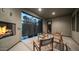 Charming patio featuring a fireplace, ambient lighting, and privacy screen, creating a serene atmosphere at 11673 N 136Th St # 1005, Scottsdale, AZ 85259