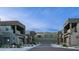 Contemporary townhomes feature unique architectural details, private garages, and desert landscaping for stylish, low-maintenance living at 11673 N 136Th St # 1005, Scottsdale, AZ 85259