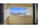 Balcony view overlooking a neighborhood with townhomes under a bright blue sky at 1222 W Baseline Rd # 114, Tempe, AZ 85283