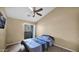 Bedroom with sliding glass door to private balcony and ceiling fan at 1222 W Baseline Rd # 114, Tempe, AZ 85283