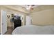 Bedroom featuring a ceiling fan, walk-in closet, and neutral walls at 1222 W Baseline Rd # 114, Tempe, AZ 85283