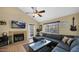Cozy living room featuring a fireplace, comfortable seating, and natural light at 1222 W Baseline Rd # 114, Tempe, AZ 85283