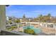 Community pool surrounded by lush landscaping and views of the residential buildings at 1222 W Baseline Rd # 114, Tempe, AZ 85283