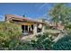 Secluded backyard offering a covered patio, lush lawn, and mature plants at 13601 S 37Th St, Phoenix, AZ 85044