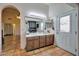 Bright bathroom featuring double vanity sinks and access to the backyard at 13601 S 37Th St, Phoenix, AZ 85044