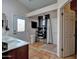 Bright bathroom featuring a walk-in shower, and private entry to the outdoor patio at 13601 S 37Th St, Phoenix, AZ 85044