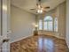 Empty bedroom with laminate flooring, modern ceiling fan, and shuttered windows at 13601 S 37Th St, Phoenix, AZ 85044