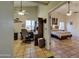 Spacious living area leading to a cozy bedroom with neutral walls and a ceiling fan at 13601 S 37Th St, Phoenix, AZ 85044