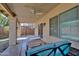 Relaxing covered patio area featuring ceiling fan, furniture, and easy access to the backyard at 13601 S 37Th St, Phoenix, AZ 85044
