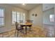 Cozy dining area with a round table, decorative chairs, and ample natural light from the window at 13601 S 37Th St, Phoenix, AZ 85044