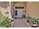 Inviting front porch with plants and seating, leading to the home's entrance, creating a welcoming atmosphere at 13601 S 37Th St, Phoenix, AZ 85044