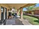 Relaxing covered patio with comfortable seating overlooking a meticulously maintained backyard at 13601 S 37Th St, Phoenix, AZ 85044