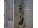 Accessible walk-in shower with safety bars and built-in storage shelves at 13601 S 37Th St, Phoenix, AZ 85044