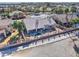 Inviting backyard with a refreshing pool, desert landscaping and a covered patio at 1414 E Amberwood Dr, Phoenix, AZ 85048