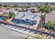 Private backyard featuring a pool, covered patio, and desert landscaping at 1414 E Amberwood Dr, Phoenix, AZ 85048