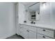 Modern bathroom with a single vanity, stylish fixtures, and sleek tile backsplash at 1414 E Amberwood Dr, Phoenix, AZ 85048