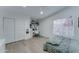 Cozy bedroom with wood floors, a built-in desk area, and a large window at 1414 E Amberwood Dr, Phoenix, AZ 85048