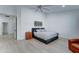 Bright bedroom features hardwood floors and a gray bed at 1414 E Amberwood Dr, Phoenix, AZ 85048